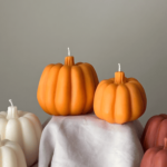Pumpkin-shaped candle