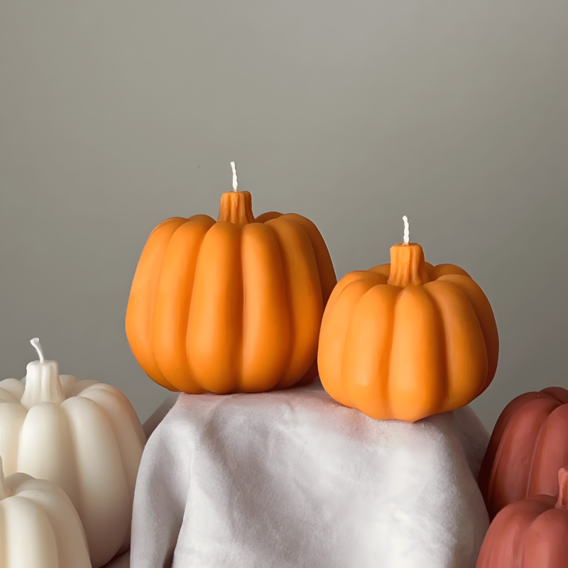 Pumpkin-shaped candle