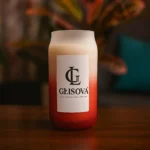 GLISOVA Offshore scented soy candle in red ombre jar.