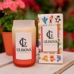 Luxury aquatic candle from the Aura Collection by a poolside