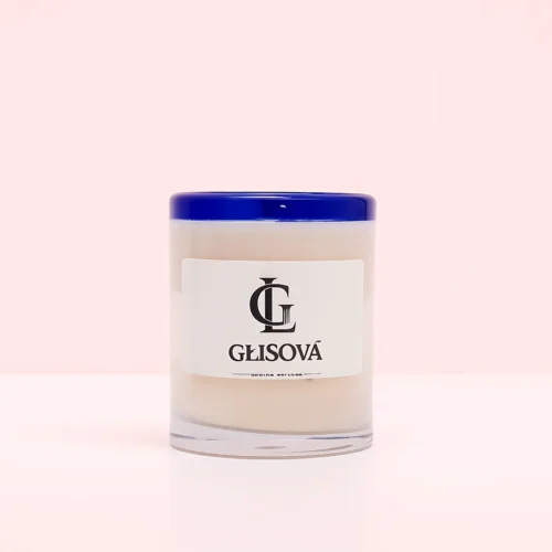 GLISOVA artisan candle with a blue rim in a home setting