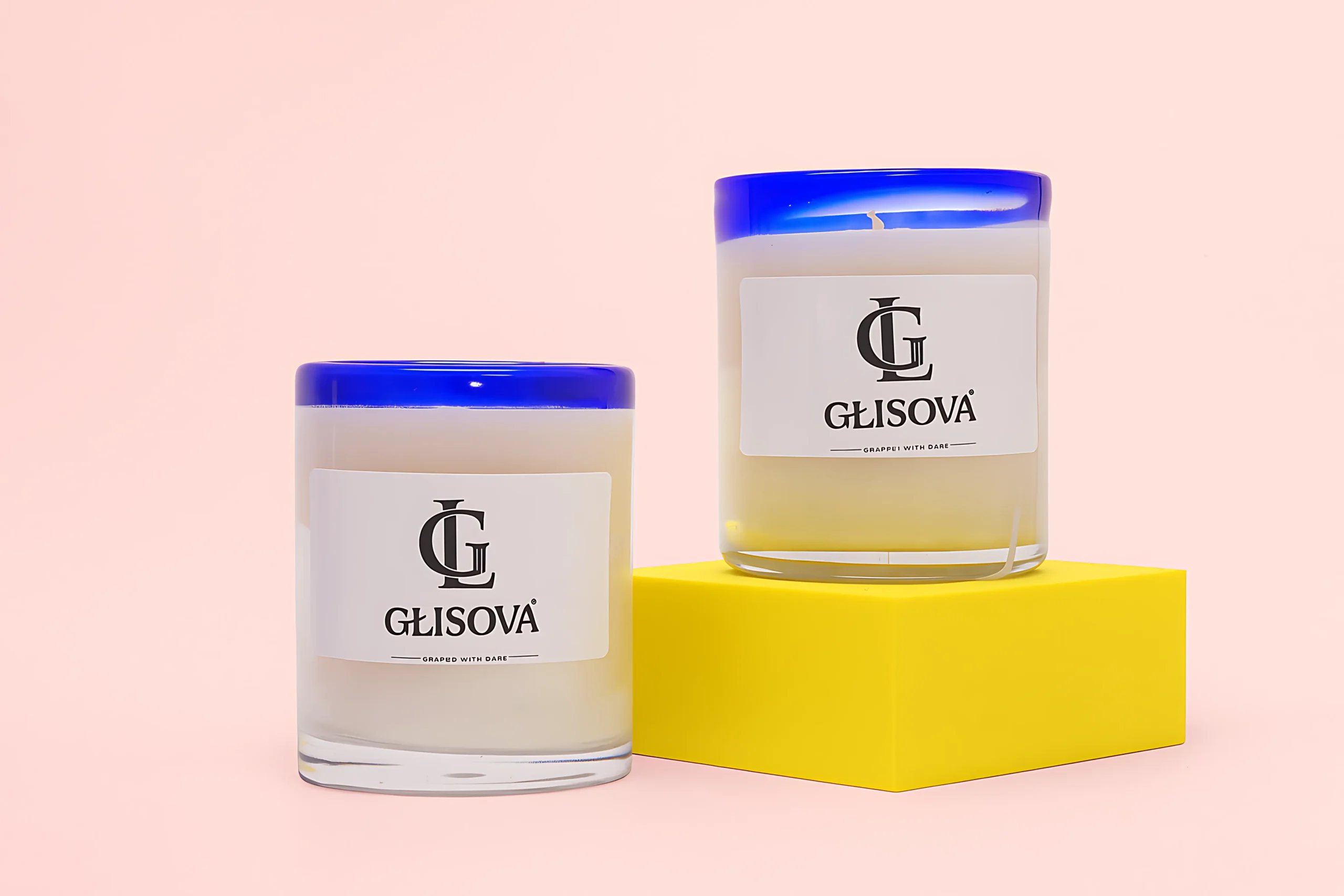Hand-poured natural soy wax candle on a pink background