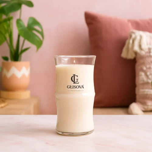Hand poured natural soy wax candle on a pink table with floral art